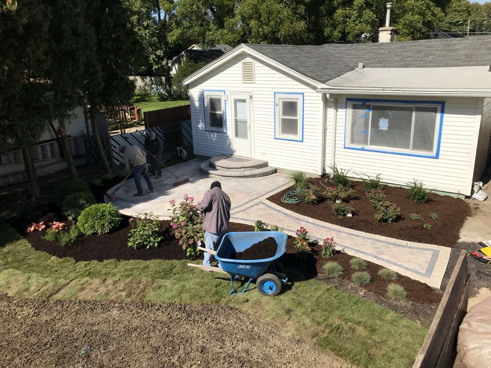Meticulous lawn pattern running along sidewalk and driveway boundaries