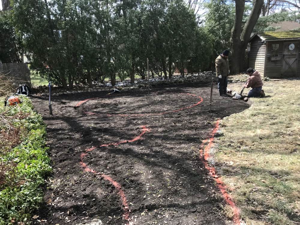 Installation of backyard drainage system and dry creek bed